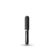 A dark grey silicone massager with a clear glass tube filled with dark particles.