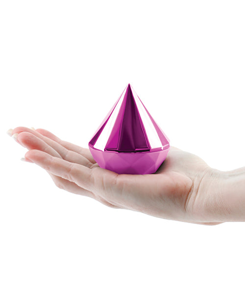 Sugar Pop Jewel pink stimulator held in a hand to show its compact size