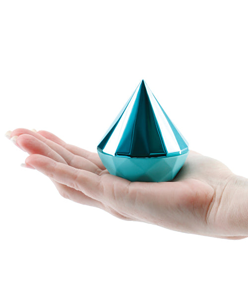 Sugar Pop Jewel teal stimulator held in a hand to show its compact size