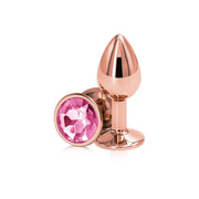 Small rose gold aluminum anal plug with a pink gem.
