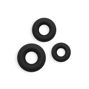 Three black silicone cock rings of varying sizes.