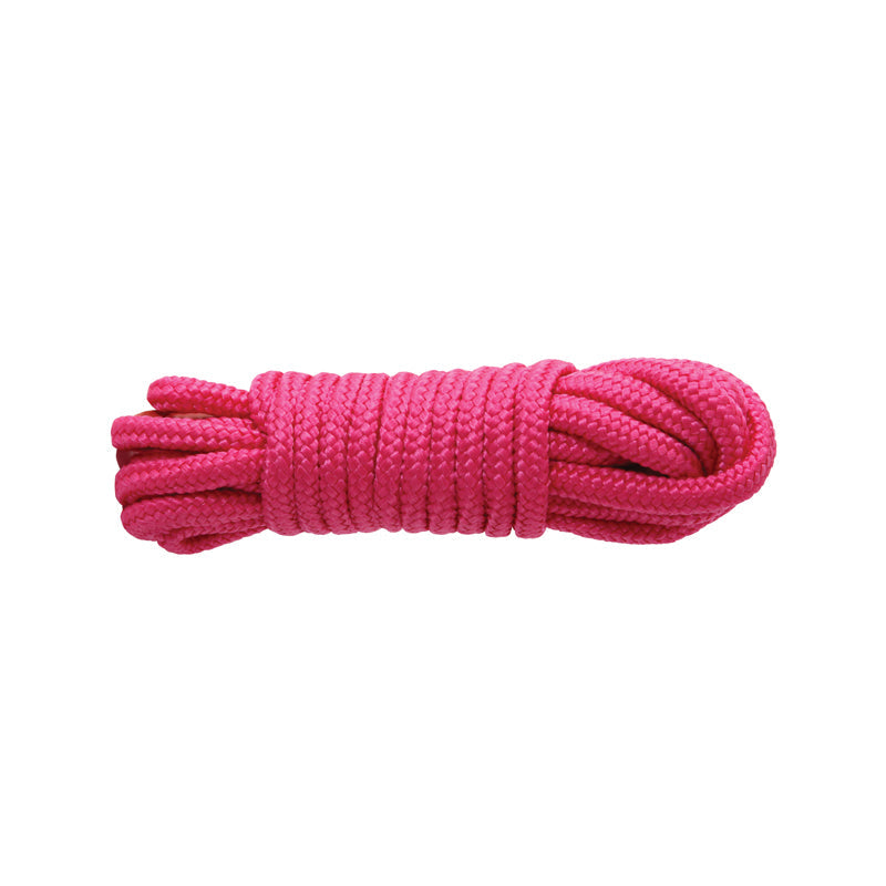 Pink braided nylon bondage rope coiled on a white background.