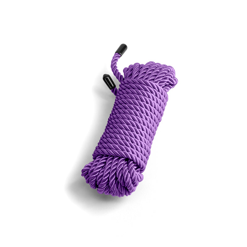 Purple cotton bondage rope with black capped ends.