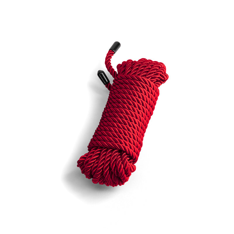 Red soft cotton bondage rope with black capped ends.