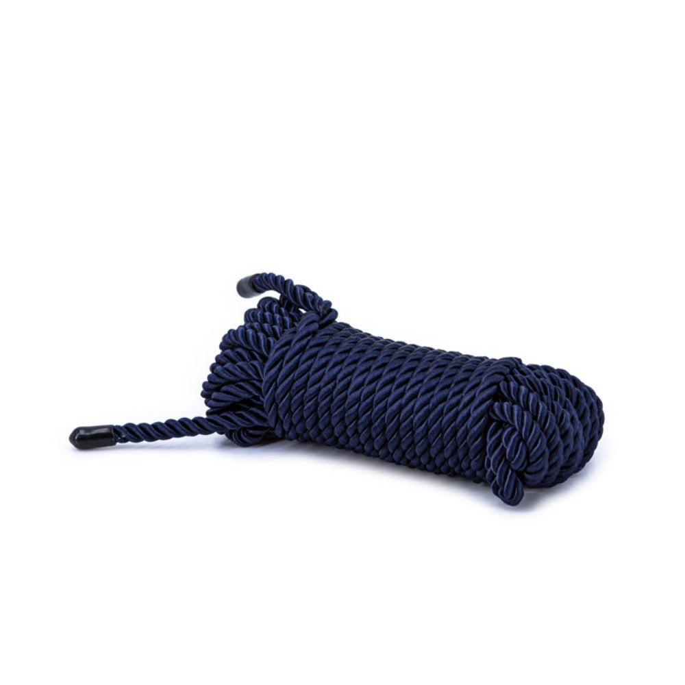 Navy blue synthetic bondage rope with black tips.