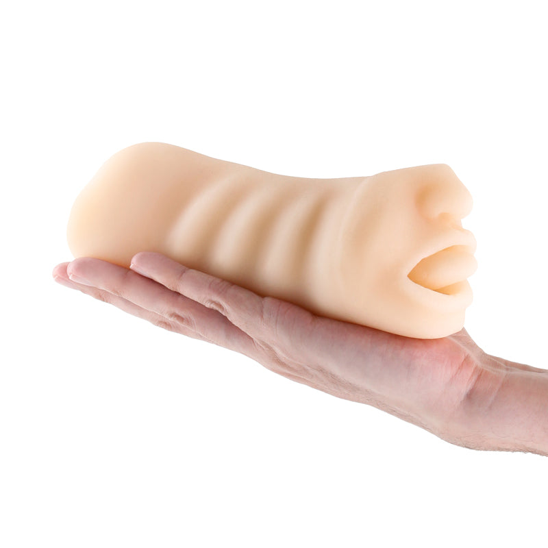 A hand holds a textured, flesh-toned male masturbator with an open mouth.