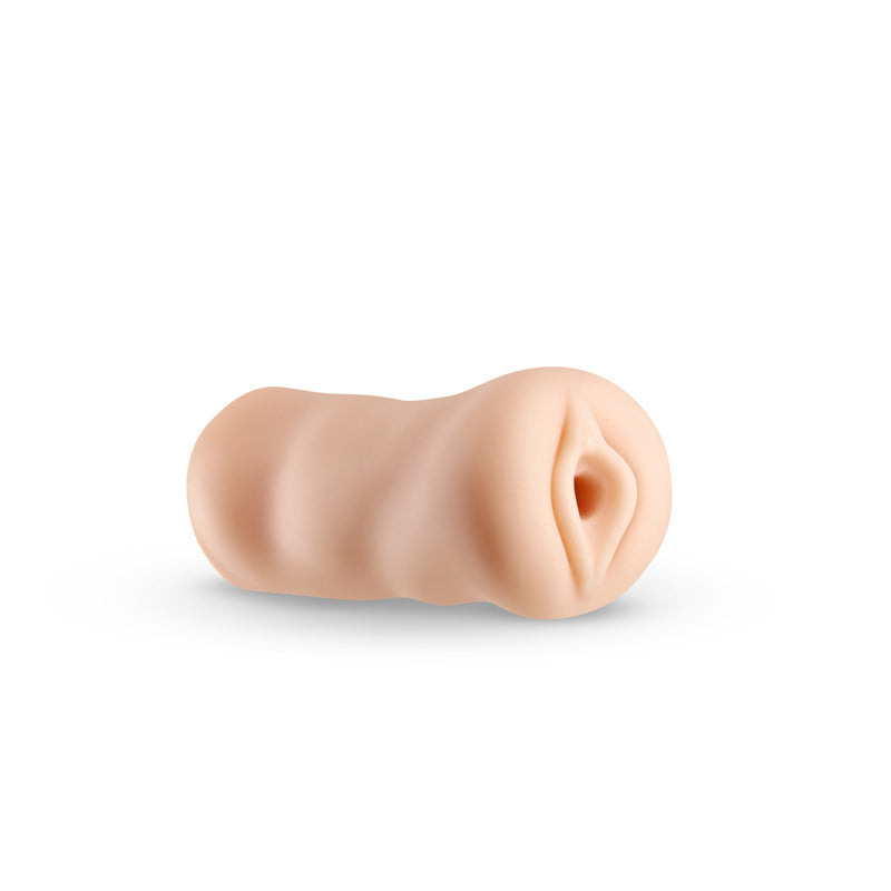 A beige textured male stroker with a realistic opening.