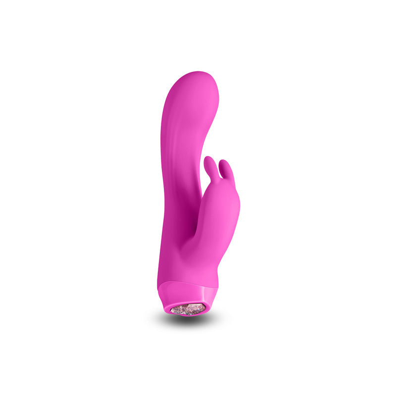 A pink silicone vibrator with two small ears at the top and a textured base.