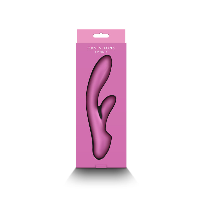 A light pink silicone vibrator in its packaging.