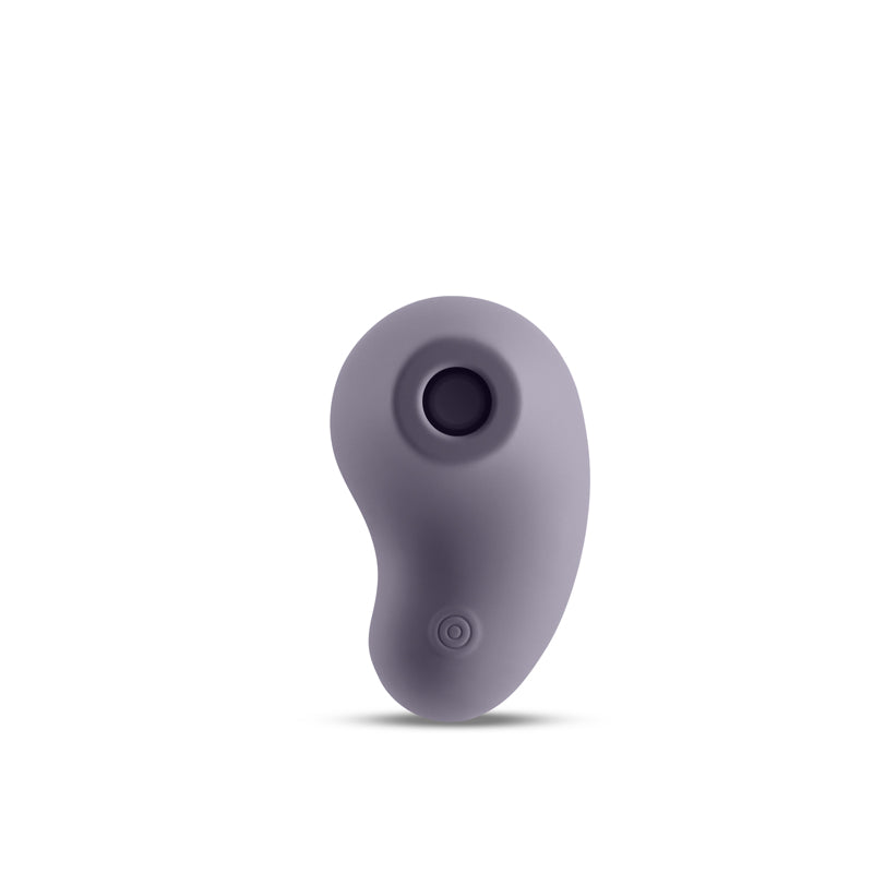 A purple, pebble-shaped stimulator with a circular opening at the top and a power button at the bottom.