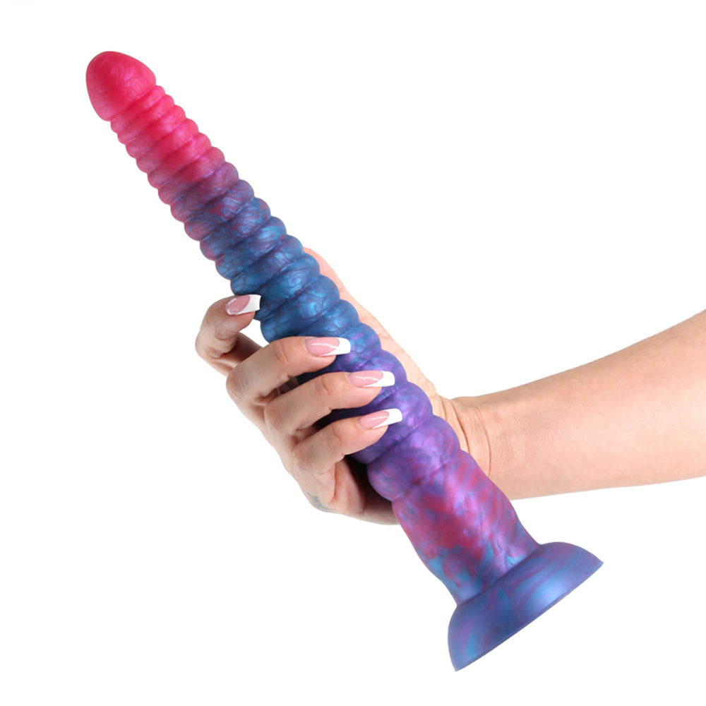 A 12-inch stacked silicone dildo in pink and blue, held in a hand.