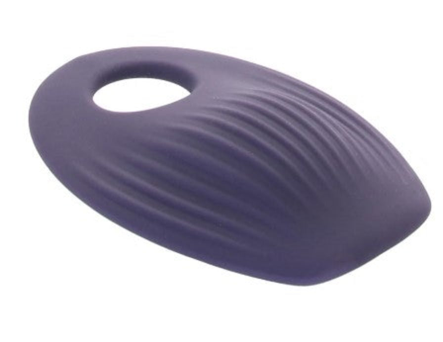 A purple, oval-shaped vibrating pad with a textured surface and a hole.