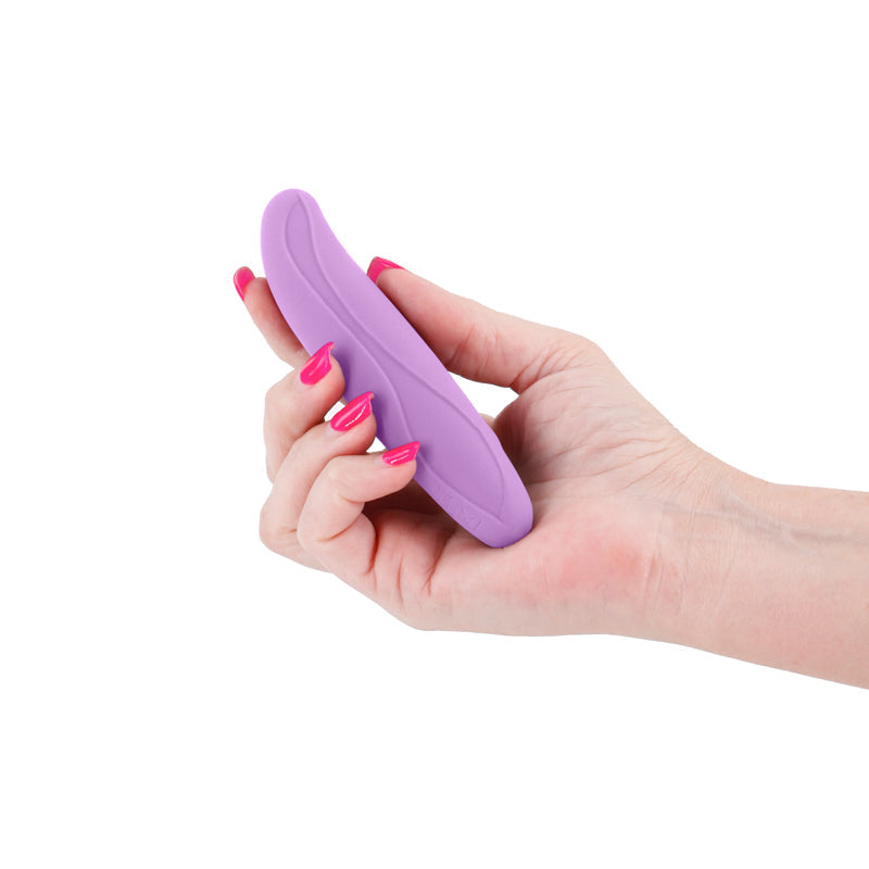 A hand holds a curved, purple silicone vibrator.