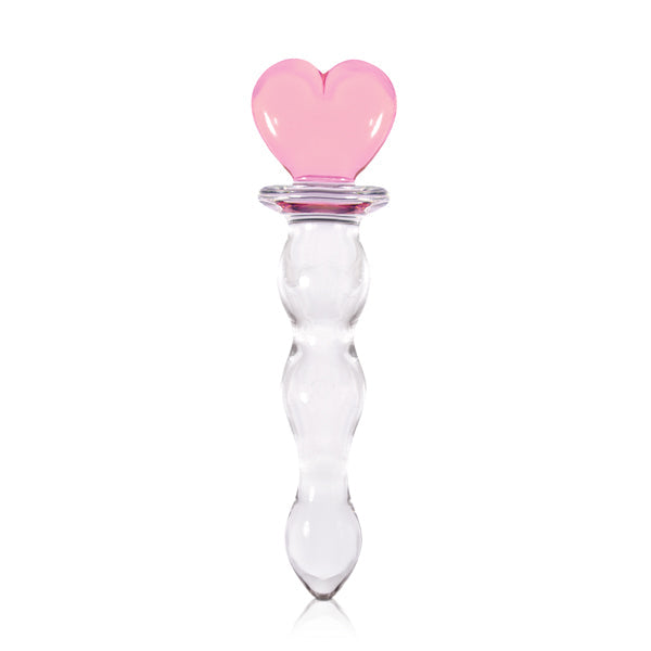 A clear glass toy with a pink heart-shaped top.