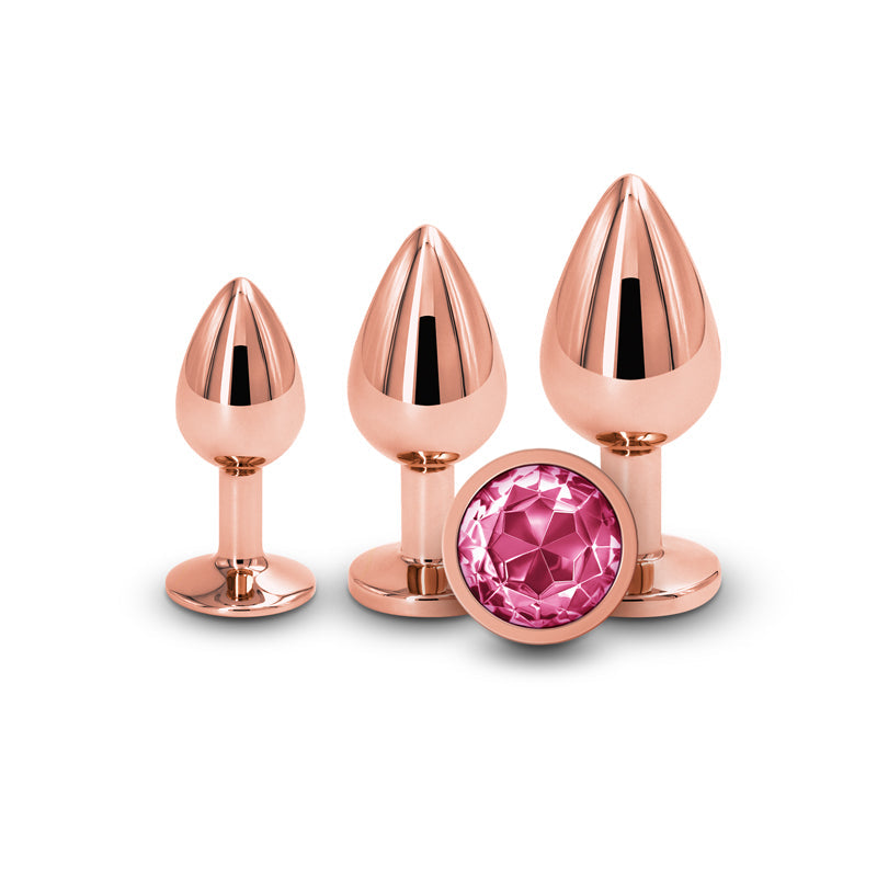 Rose gold anal trainer kit with three graduated plugs and a pink gem.