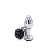 Small black aluminum anal plug with a rose design.