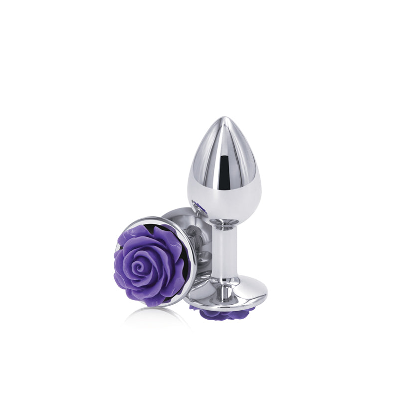 Silver anal plug with a purple rose jewel.