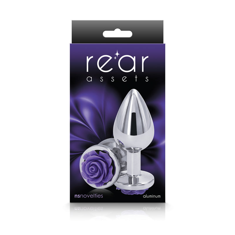 A silver anal plug with a purple rose base on a black background.
