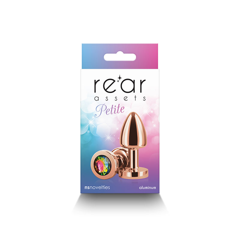 Rose gold aluminum anal plug with rainbow gem on a box.