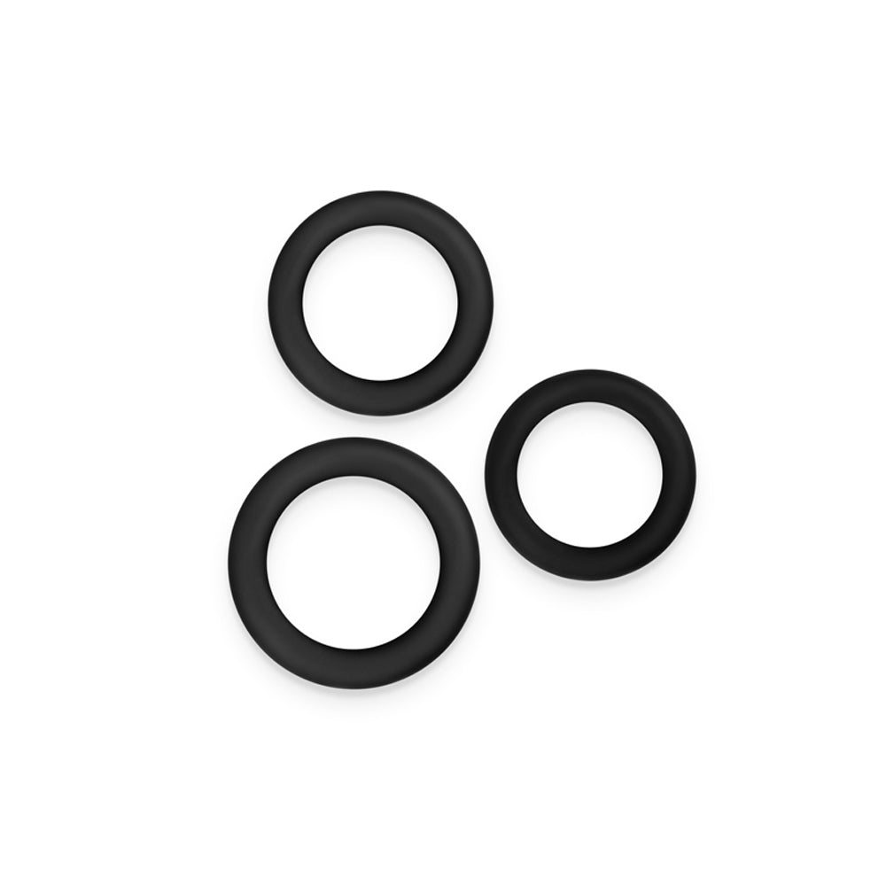 Three black silicone rings of varying sizes.