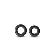 Two black stretchy cock rings on a white background.