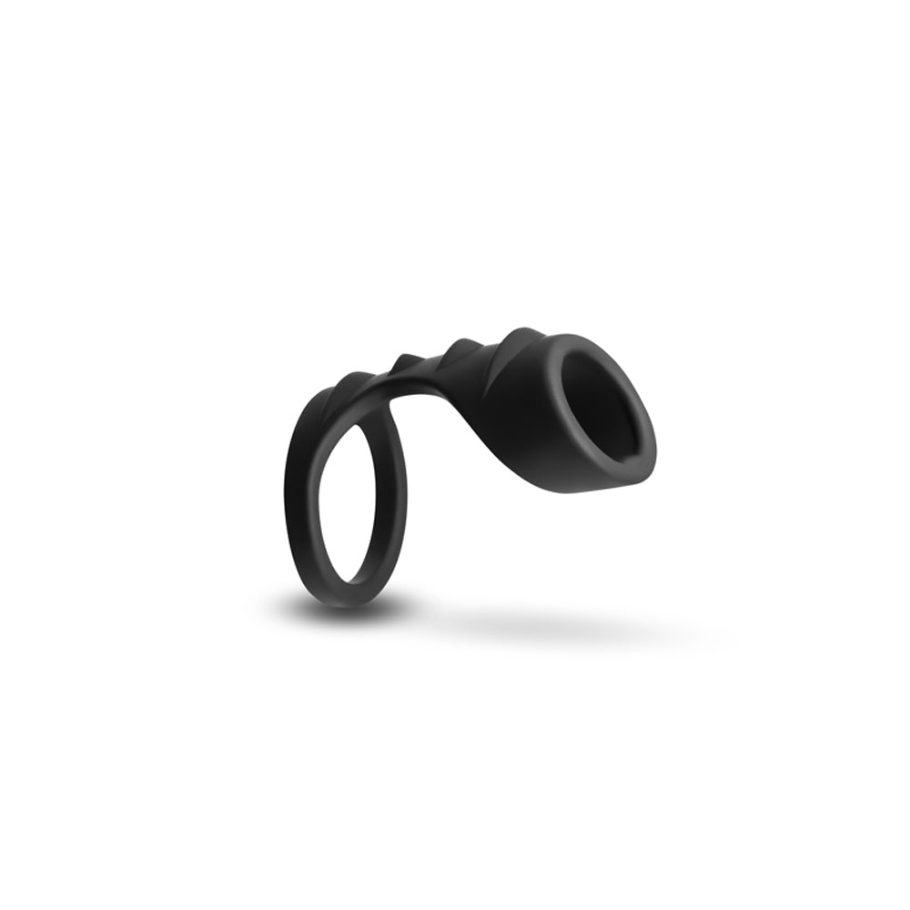 Black silicone penis harness with a ribbed texture.