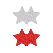 Two pairs of glitter star nipple covers, one red and one silver.