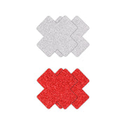 Two sets of glitter cross nipple pasties, one red and one silver.