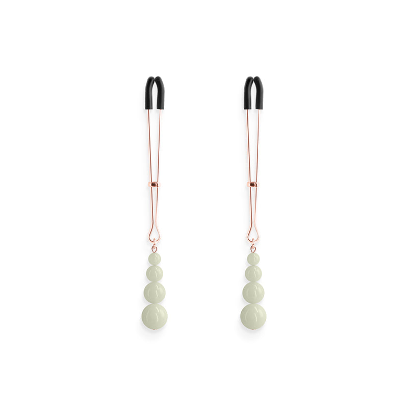 Adjustable nipple clamps with glow in the dark beads.
