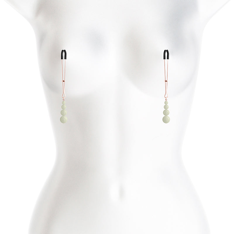 Adjustable nipple clamps with glow in the dark beads.