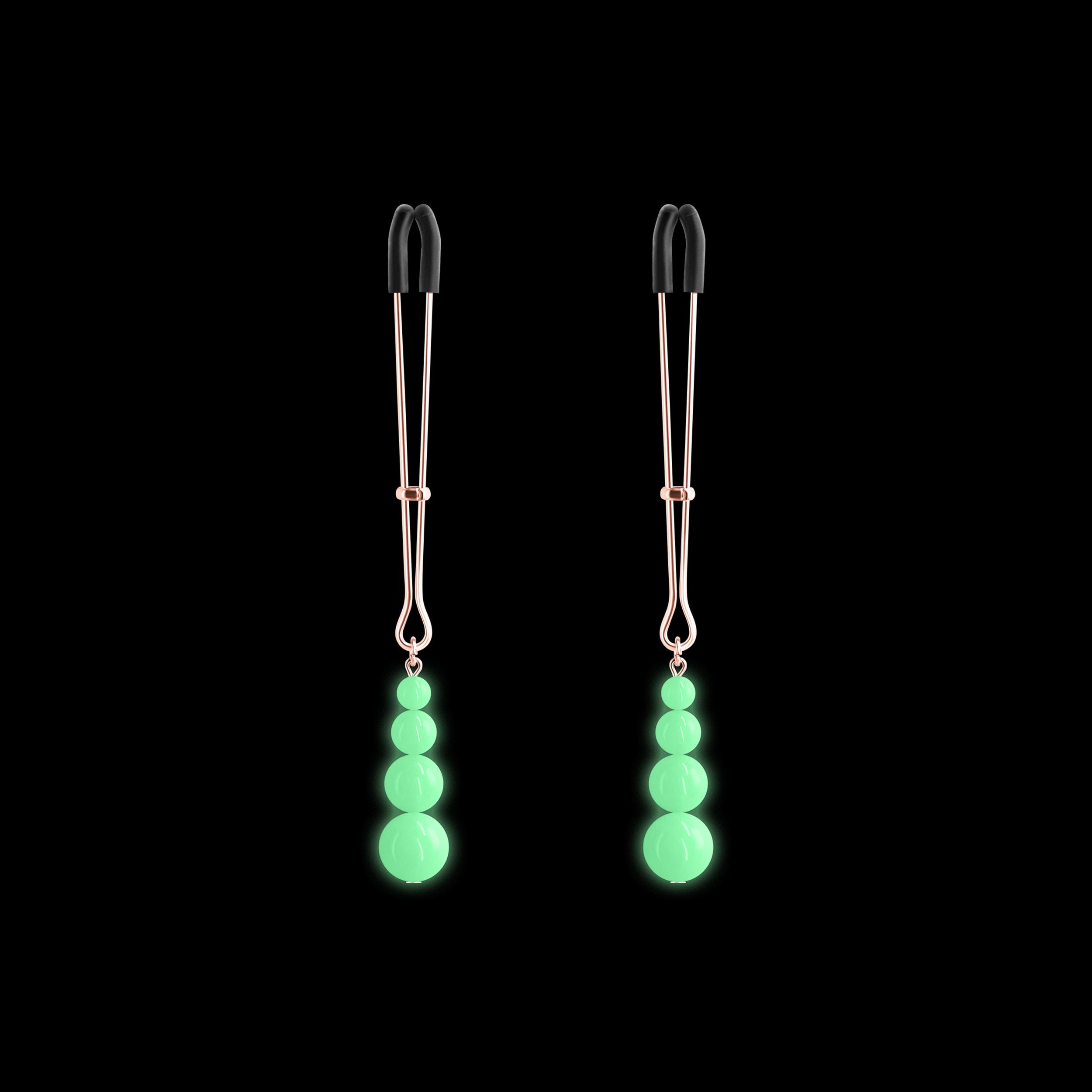 Adjustable nipple clamps with glow in the dark beads.