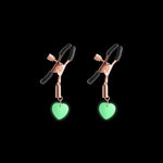 Adjustable nipple clamps with glow-in-the-dark heart charms.