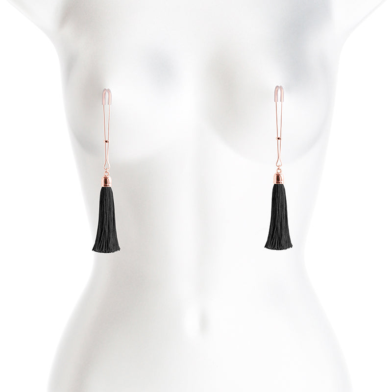 Adjustable rose gold nipple clamps with black tassels and silicone tips.