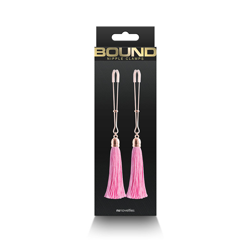 Adjustable nipple clamps with pink tassels and silicone tips.