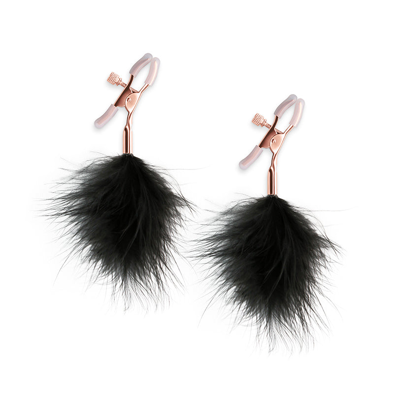 Adjustable nipple clamps with black feather poms.
