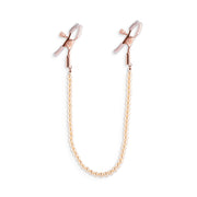 Adjustable rose gold nipple clamps with a pearl bead chain.