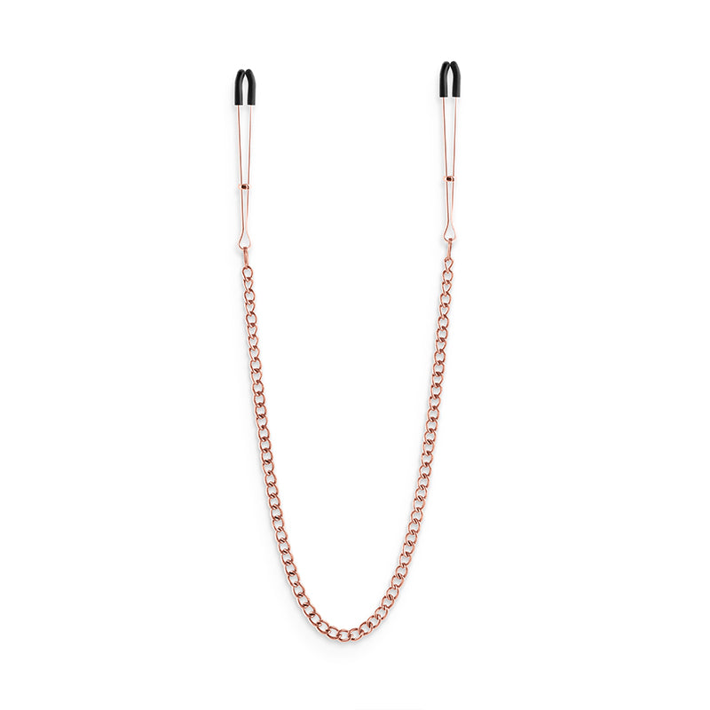 Rose gold adjustable nipple clamps with silicone tips and a connecting chain.