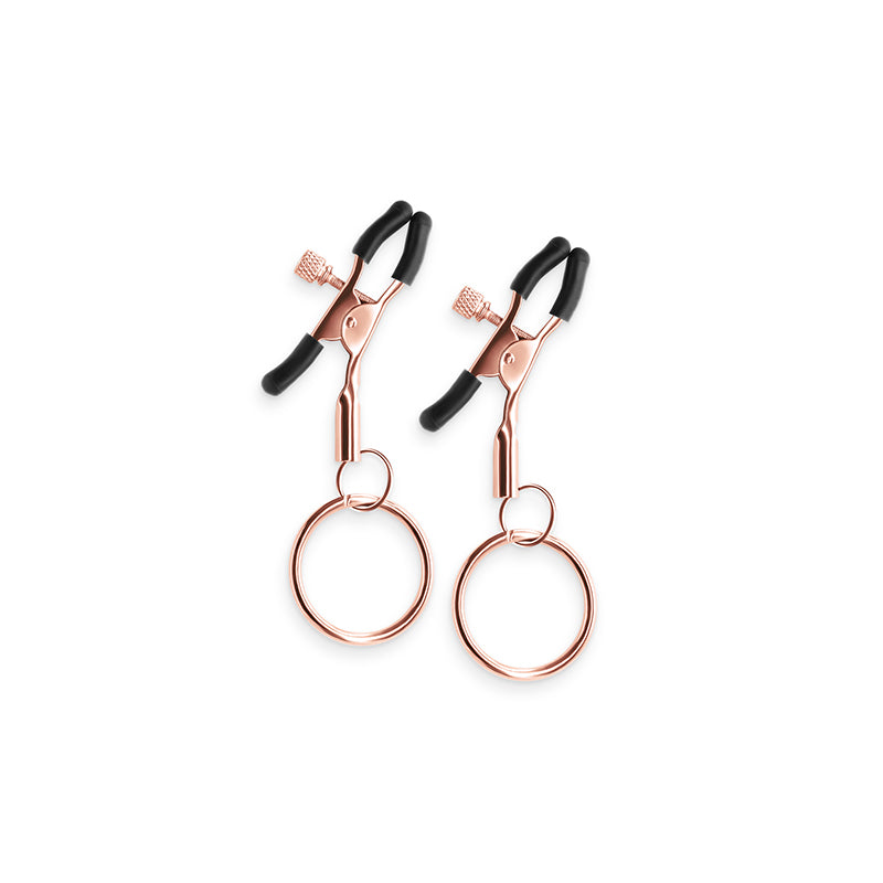 Adjustable rose gold nipple clamps with silicone tips and rings.