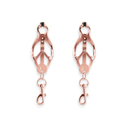 Rose gold nipple clamps with silicone tips and dangling clips.