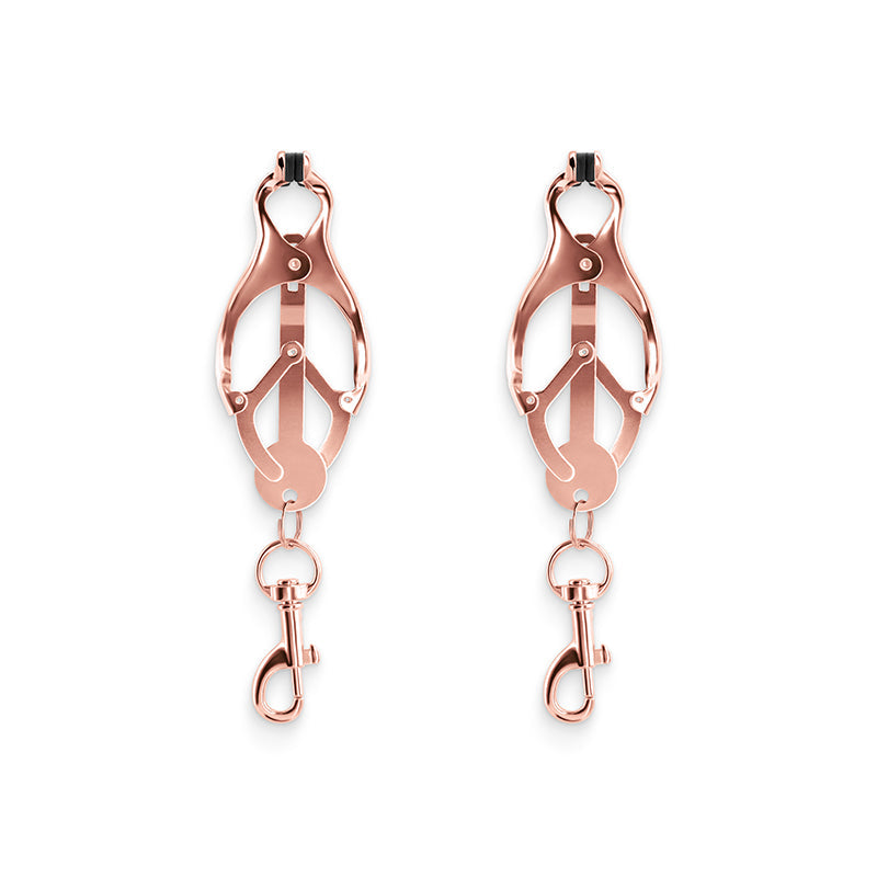 Rose gold nipple clamps with silicone tips and dangling clips.