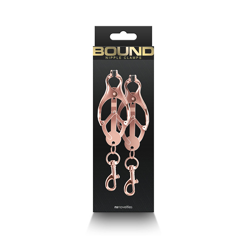 Rose gold nipple clamps with silicone tips and weight hooks.