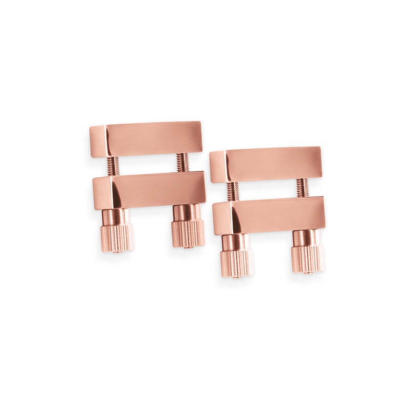Adjustable rose gold stainless steel nipple clamps with ribbed knobs.