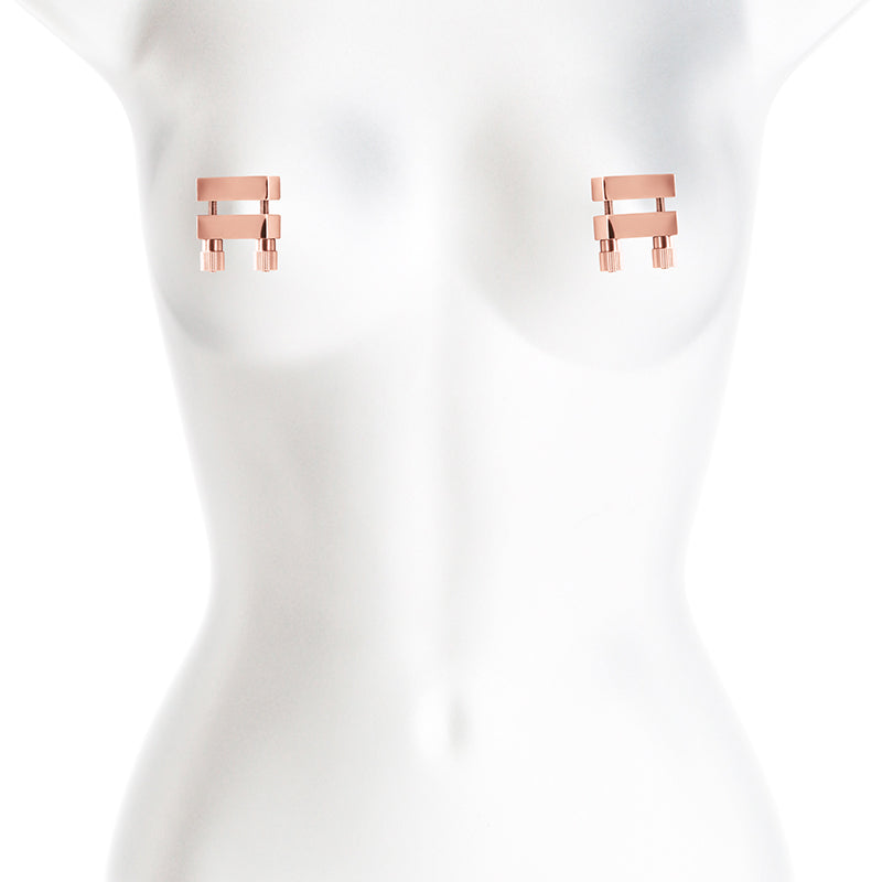 Adjustable rose gold stainless steel nipple clamps on a mannequin.