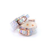 Rainbow holographic ankle cuffs with rose gold buckles.