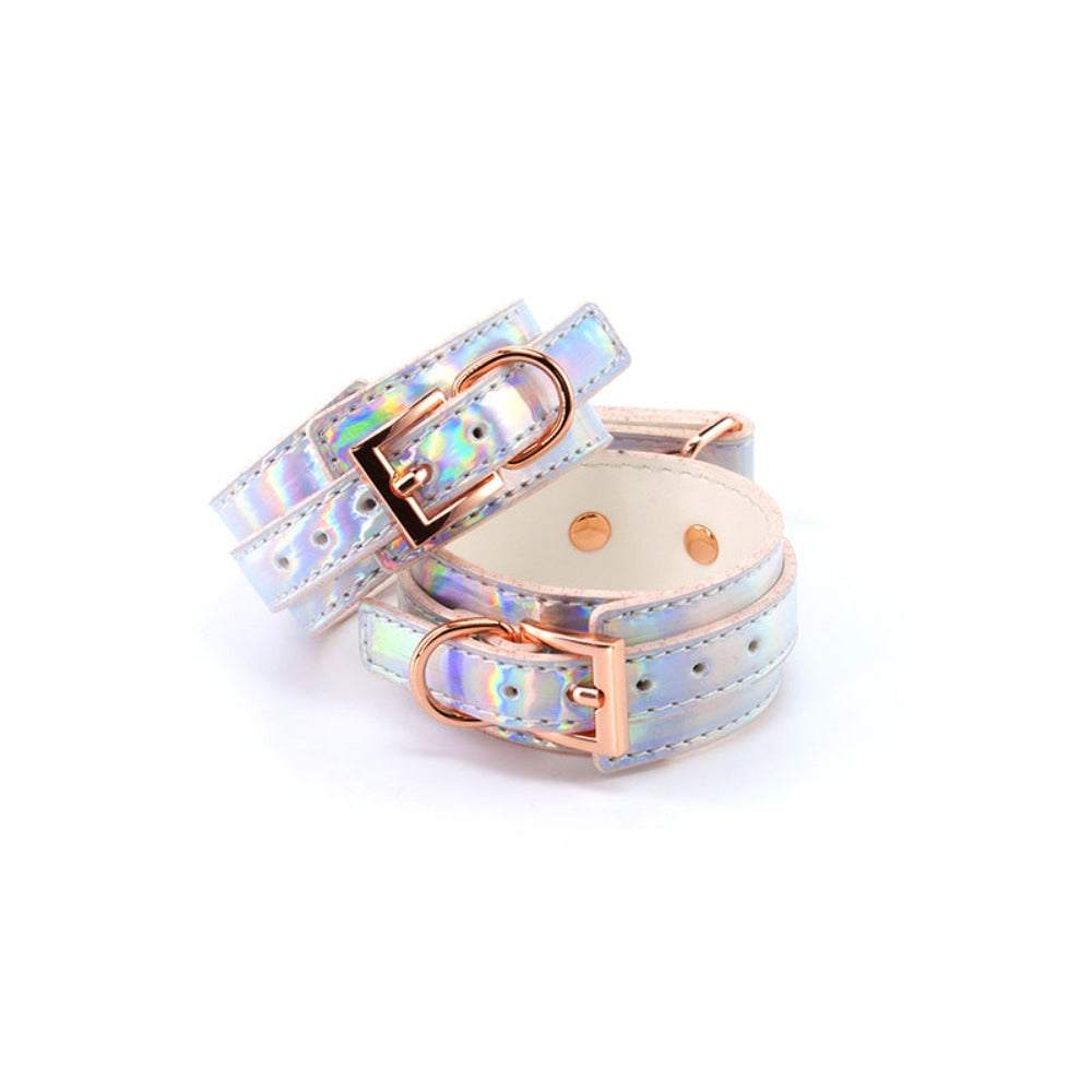 Rainbow holographic ankle cuffs with rose gold buckles.