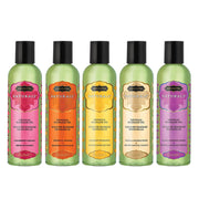 Five bottles of Kama Sutra Naturals massage oil in different flavors.