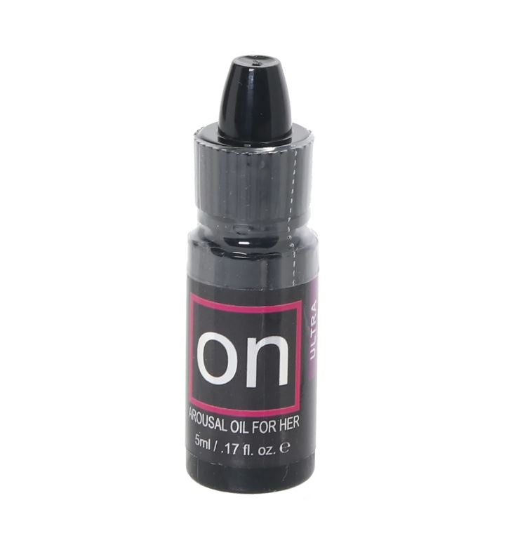 A small bottle of ON Ultra Arousal Oil for Her with a black dropper top.