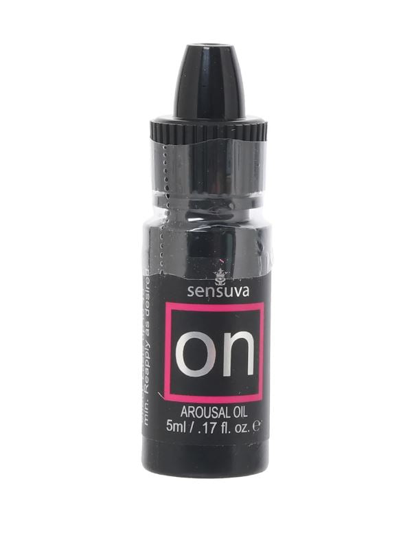Sensuva on arousal oil in a small black bottle with a pink square label.