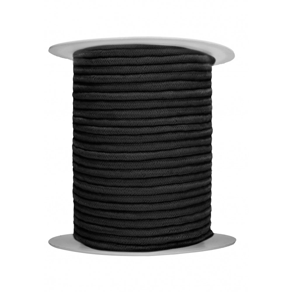 A spool of black cotton bondage rope.