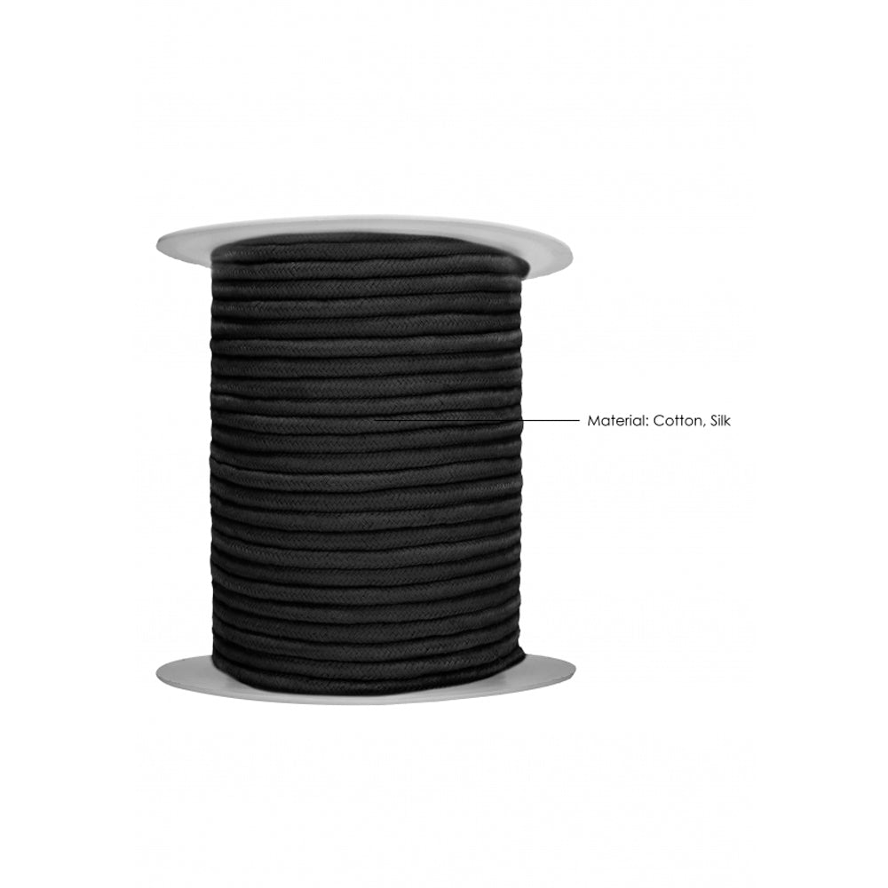 Black cotton rope on a spool, labeled "Material: Cotton, Silk".